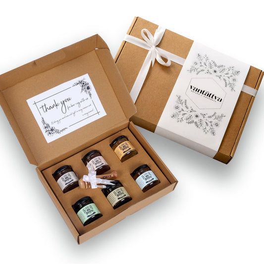 six 50g raw honey jars with wooden dipper in a craft gift box