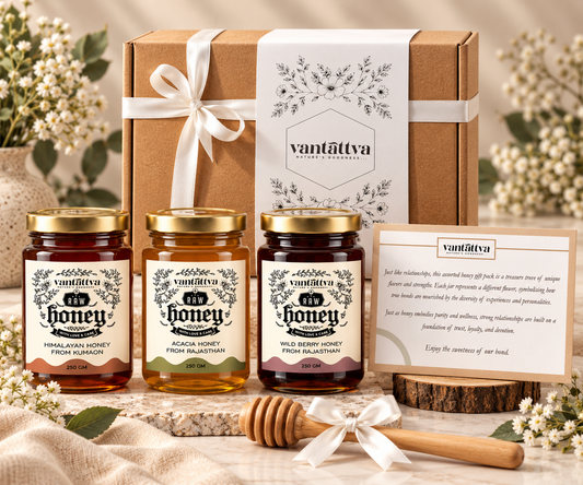 Three 250g jars of raw honey (Himalayan Forest, Sheesham, Wild Flora) with a wooden dipper in a craft gift box. Ideal for festive and corporate gifting.